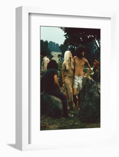 A Couple Stand Together at the Woodstock Music and Arts Fair, Bethel, New York, August 1969-John Dominis-Framed Photographic Print