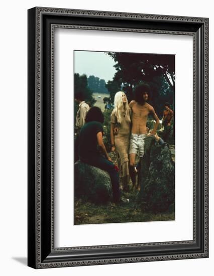 A Couple Stand Together at the Woodstock Music and Arts Fair, Bethel, New York, August 1969-John Dominis-Framed Photographic Print