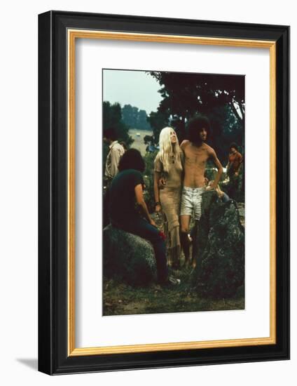 A Couple Stand Together at the Woodstock Music and Arts Fair, Bethel, New York, August 1969-John Dominis-Framed Photographic Print