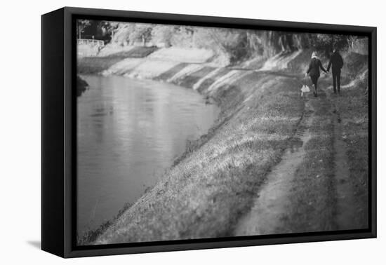 A Couple Walking Along a Canal on a Wet Day-Clive Nolan-Framed Premier Image Canvas