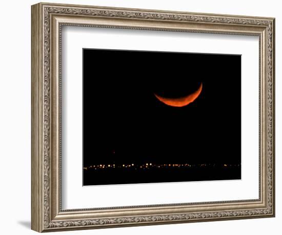 A Crescent Moon Dwarfs the Lights of Fort Riley Army Base in Central Kansas, January 22, 2007-Charlie Riedel-Framed Photographic Print