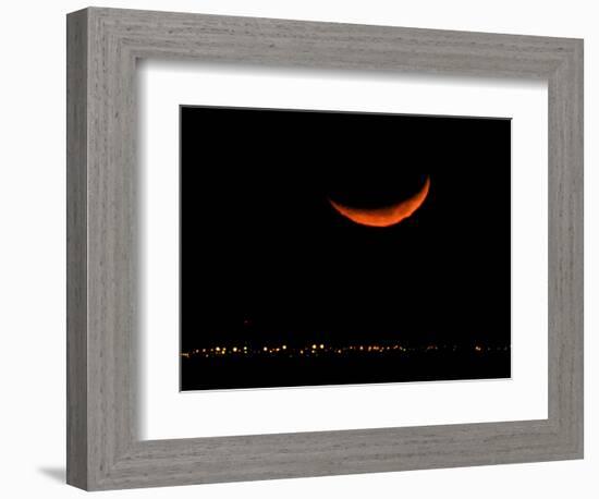 A Crescent Moon Dwarfs the Lights of Fort Riley Army Base in Central Kansas, January 22, 2007-Charlie Riedel-Framed Photographic Print