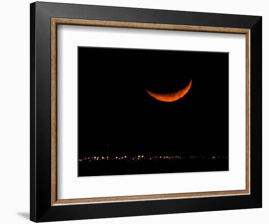 A Crescent Moon Dwarfs the Lights of Fort Riley Army Base in Central Kansas, January 22, 2007-Charlie Riedel-Framed Photographic Print