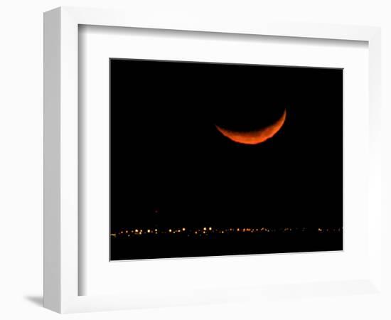 A Crescent Moon Dwarfs the Lights of Fort Riley Army Base in Central Kansas, January 22, 2007-Charlie Riedel-Framed Photographic Print