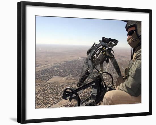 A Crew Chief Looks out for Suspicious Activity While Manning a Helicopters Machine Gun-Stocktrek Images-Framed Photographic Print