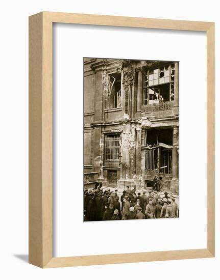 A crowd of men gathered in front of a ruined building, Germany c1918-c1919(?) (1936)-Unknown-Framed Photographic Print