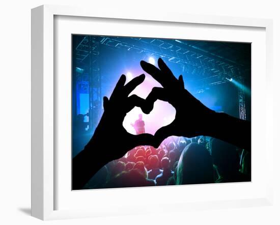 A Crowd of People at a Concert with a Heart Shaped Hand Shadow-graphicphoto-Framed Photographic Print