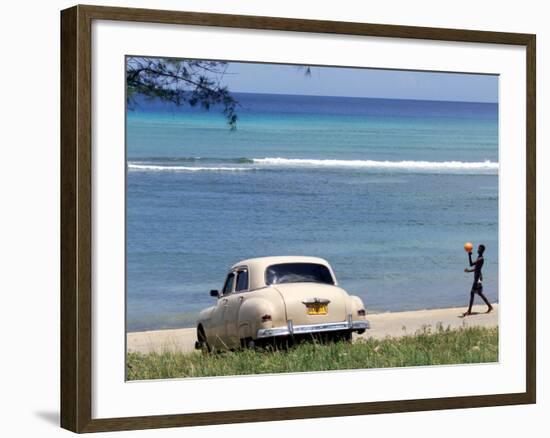 A Cuban Boy Plays Ball at the Baracoa Beach West of Havana, Cuba-null-Framed Photographic Print