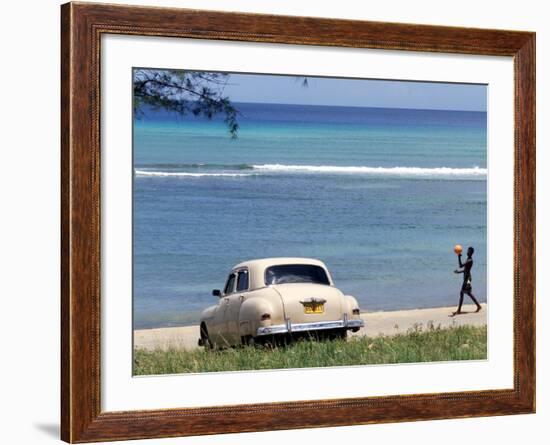 A Cuban Boy Plays Ball at the Baracoa Beach West of Havana, Cuba-null-Framed Photographic Print