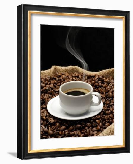 A Cup of Coffee on a Jute Sack Full of Coffee Beans-Gustavo Andrade-Framed Photographic Print