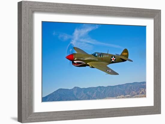 A Curtiss P-40E Warhawk in Flight Near Chino, California-null-Framed Photographic Print