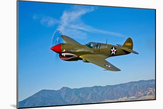 A Curtiss P-40E Warhawk in Flight Near Chino, California-null-Mounted Photographic Print