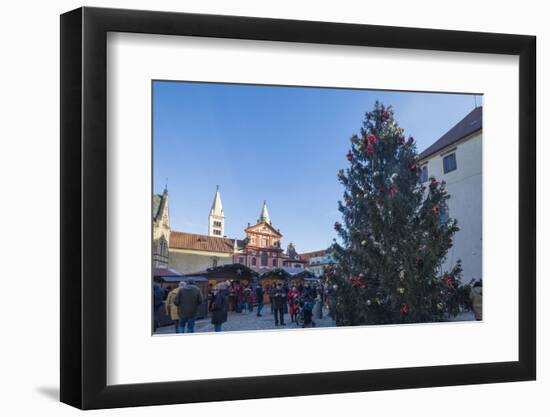 A decorated Christmas tree frames the St. George Church, Prague, Czech Republic, Europe-Roberto Moiola-Framed Photographic Print