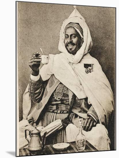 A Decorated Moroccan Tribal Chief Enjoying a Cup of Coffee-null-Mounted Photographic Print