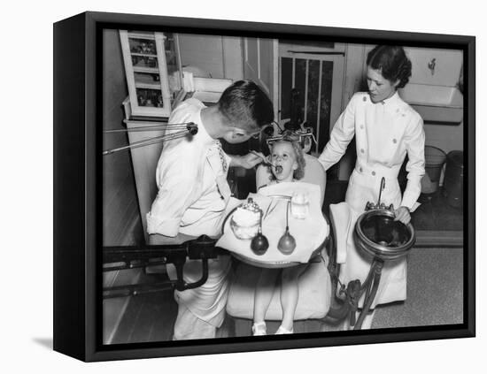 A Dentist Examining a Young Girl's Teeth in 1942-null-Framed Stretched Canvas