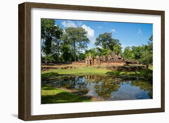 A deserted temple reflected in a lake in Siem Reap, Cambodia, Indochina, Southeast Asia, Asia-Logan Brown-Framed Photographic Print