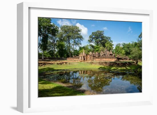 A deserted temple reflected in a lake in Siem Reap, Cambodia, Indochina, Southeast Asia, Asia-Logan Brown-Framed Photographic Print