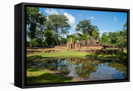 A deserted temple reflected in a lake in Siem Reap, Cambodia, Indochina, Southeast Asia, Asia-Logan Brown-Framed Premier Image Canvas