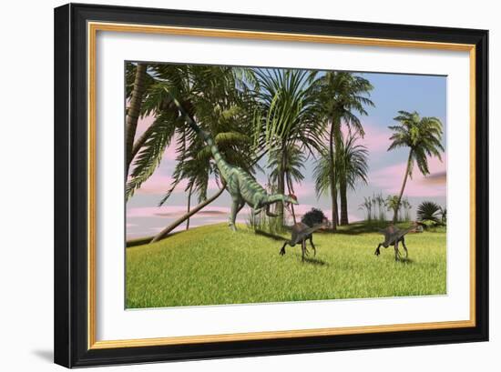 A Dilophosaurus Chasing Two Gigantoraptors across a Grassy Field-null-Framed Art Print