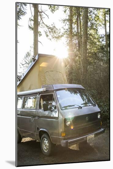 A Dog Peaks His Head Out In The Morning From A Volkswagen Bus On The Washington Coast-Hannah Dewey-Mounted Photographic Print