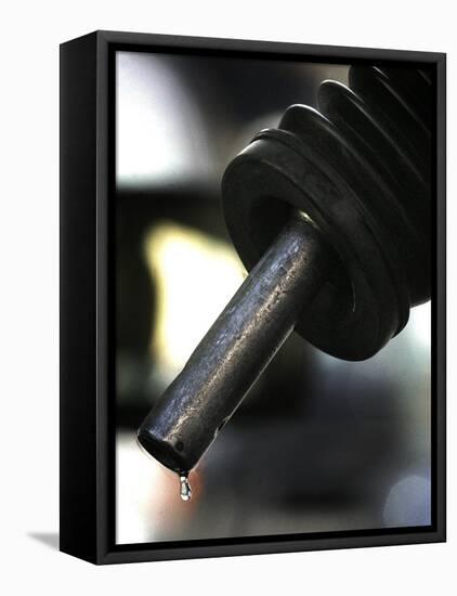 A Drip of Gas Falls from Nozzle at a Gasoline Station-null-Framed Premier Image Canvas