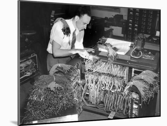 A Engineer Works on a IBM Computer Used to Administer Gl Insurance Dividend for Millions of Vets-null-Mounted Photo