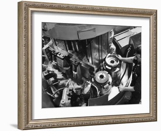 A Factory Worker Operates a Ryder Disc Brake Pad Machine. Photograph by Heinz Zinram-Heinz Zinram-Framed Photographic Print