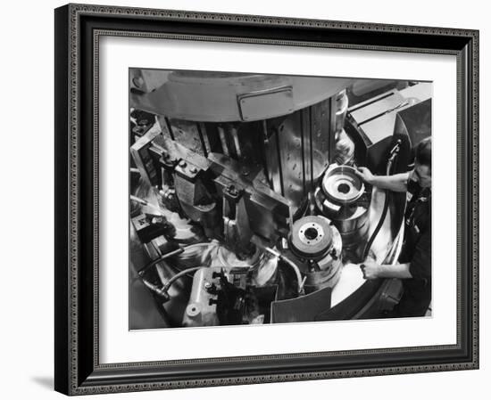 A Factory Worker Operates a Ryder Disc Brake Pad Machine. Photograph by Heinz Zinram-Heinz Zinram-Framed Photographic Print