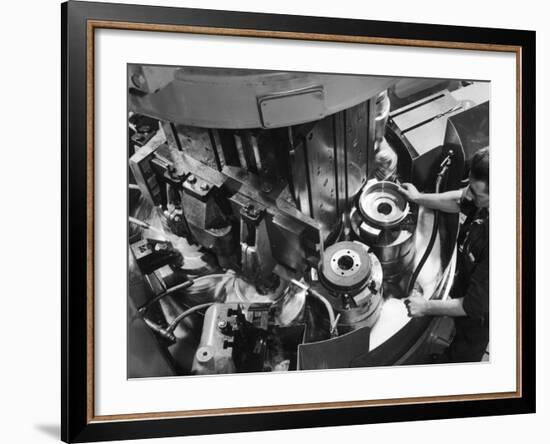 A Factory Worker Operates a Ryder Disc Brake Pad Machine. Photograph by Heinz Zinram-Heinz Zinram-Framed Photographic Print