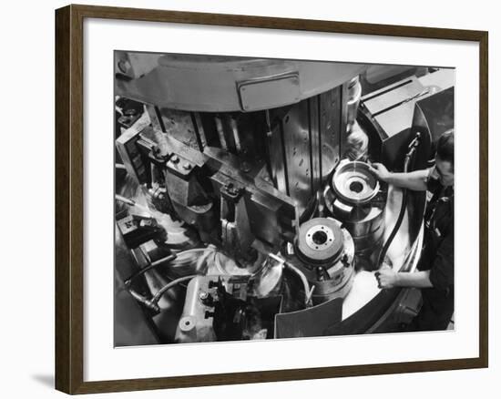 A Factory Worker Operates a Ryder Disc Brake Pad Machine. Photograph by Heinz Zinram-Heinz Zinram-Framed Photographic Print