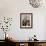 A Family from the Quake-Affected Rangwad Village Sits Near a Fireplace-null-Framed Photographic Print displayed on a wall