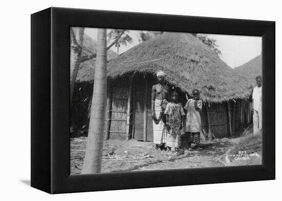 A Family in Front of their Home, Gambia, 20th Century-null-Framed Premier Image Canvas