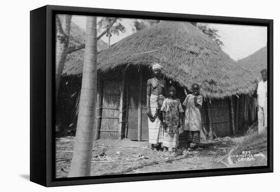 A Family in Front of their Home, Gambia, 20th Century-null-Framed Premier Image Canvas