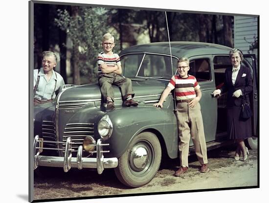 A Family Poses on and around their Plymouth Automobile, Ca. 1953-null-Mounted Photographic Print