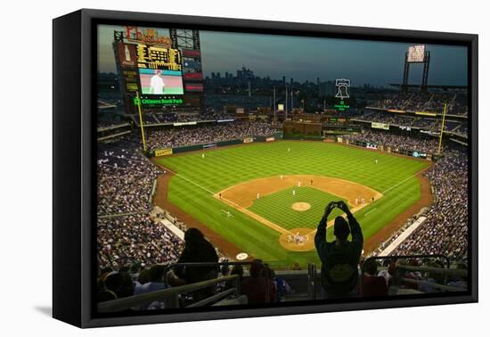 A fan with a digital camera taking a panoramic image of Citizens Bank Park, Philadelphia, PA, on...-null-Framed Premier Image Canvas