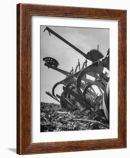 A Farmer's Harrow Digging into it the Ground-null-Framed Photographic Print