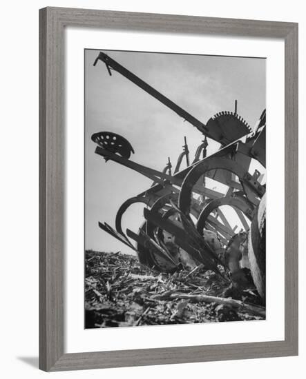 A Farmer's Harrow Digging into it the Ground-null-Framed Photographic Print