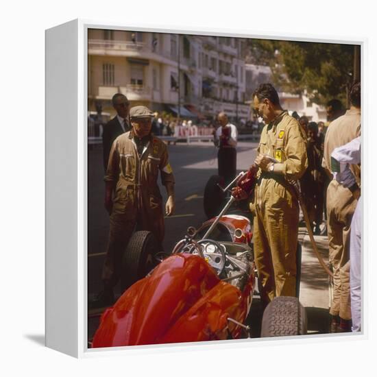 A Ferrari Team Member Filling a Car with Fuel, Monaco Grand Prix, Monte Carlo, 1963-null-Framed Premier Image Canvas