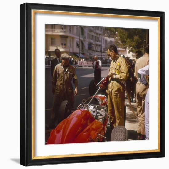 A Ferrari Team Member Filling a Car with Fuel, Monaco Grand Prix, Monte Carlo, 1963-null-Framed Photographic Print