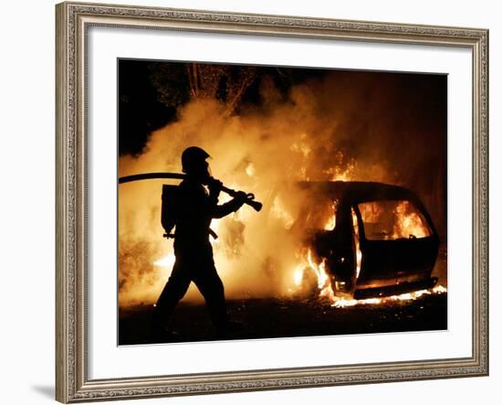 A Firefighter Extinguishes a Car in Les Musicians-null-Framed Photographic Print