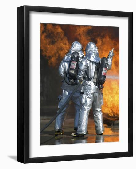 A Firefighter Fights a Fire During a Readiness Training Exercise-Stocktrek Images-Framed Photographic Print