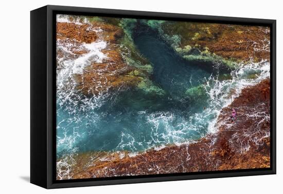 A fisherman fishes a Beryx splendens down a cliff in Fuerteventura island, Canary Islands, Spain, A-David Rocaberti-Framed Premier Image Canvas