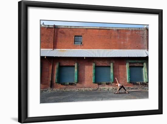 A Fit, Blonde Woman Does Yoga In Front Of An Old Brick Warehouse In Downtown Spokane, Washington-Ben Herndon-Framed Photographic Print