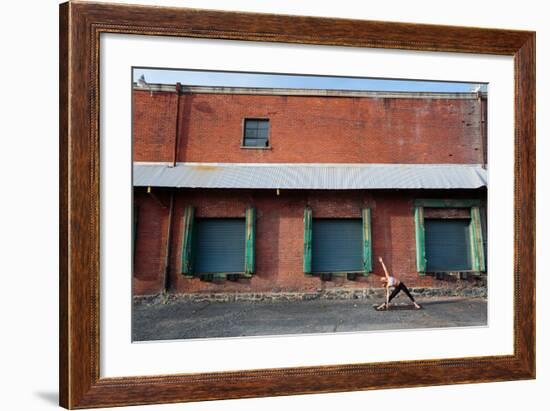 A Fit, Blonde Woman Does Yoga In Front Of An Old Brick Warehouse In Downtown Spokane, Washington-Ben Herndon-Framed Photographic Print