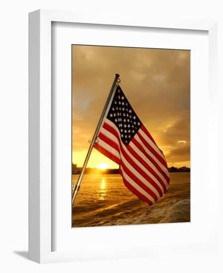 A Flag Waves Over Pearl Harbor as Dawn Breaks-null-Framed Photographic Print