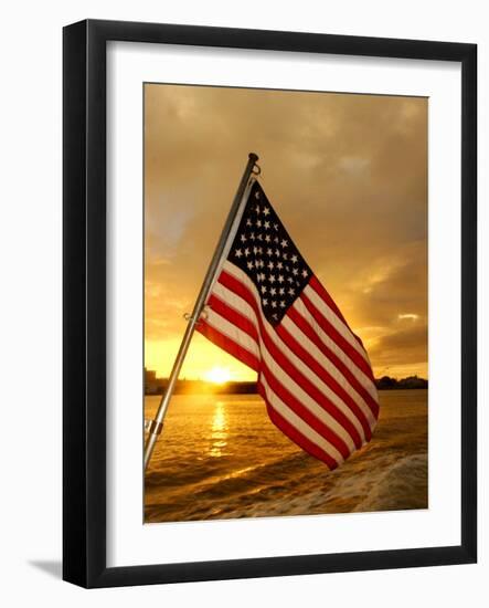 A Flag Waves Over Pearl Harbor as Dawn Breaks-null-Framed Photographic Print