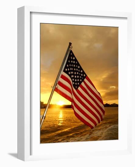 A Flag Waves Over Pearl Harbor as Dawn Breaks-null-Framed Photographic Print