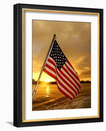 A Flag Waves Over Pearl Harbor as Dawn Breaks-null-Framed Photographic Print