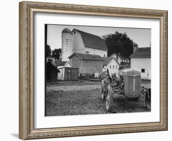 A Ford Tractor Being Sold During the Farmhouse Auction-null-Framed Premium Photographic Print