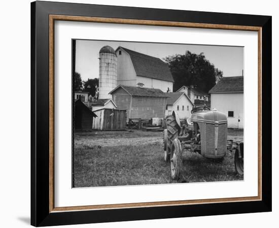 A Ford Tractor Being Sold During the Farmhouse Auction-null-Framed Premium Photographic Print